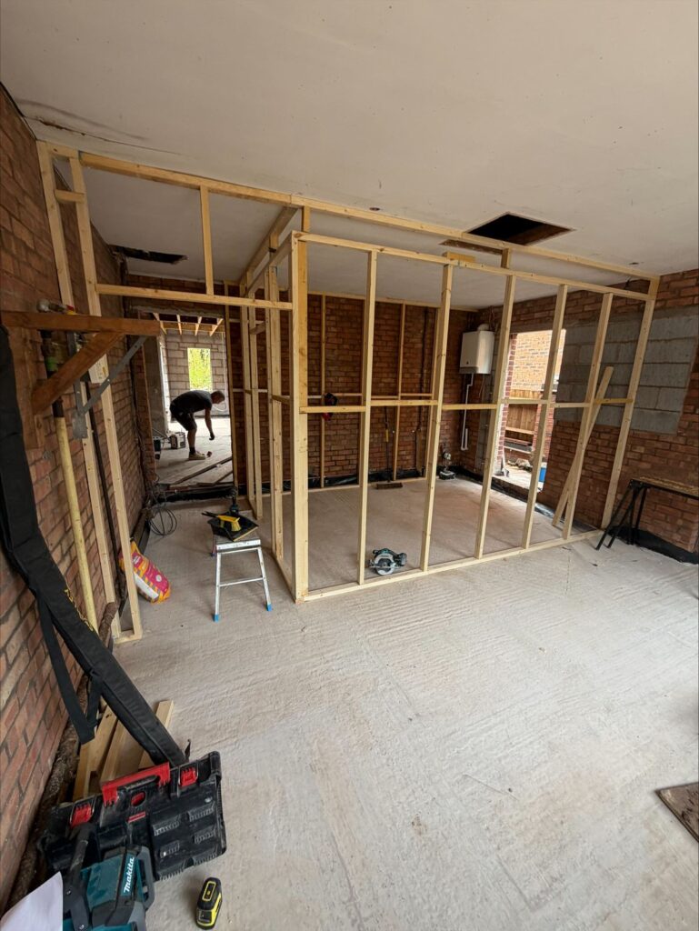 Stud wall framing during first and second fix carpentry